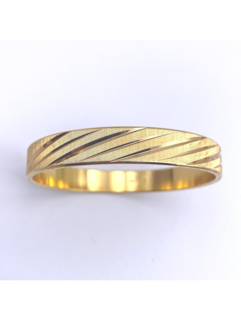 Vintage MONET Gold Tone 7 1/4" Bangle Bracelet with Diamond Cut Stripped Design.